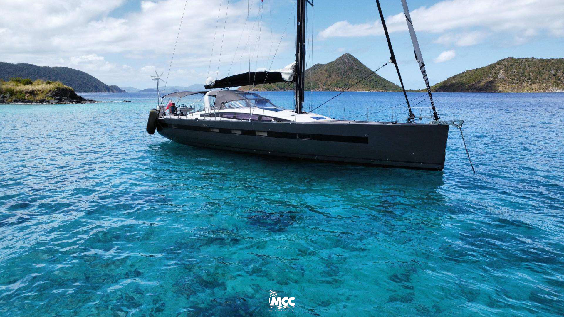 Luxury sailing yacht Bodhisattva in the Caribbean offering yoga retreats, spa treatments, and healthy gourmet cuisine.